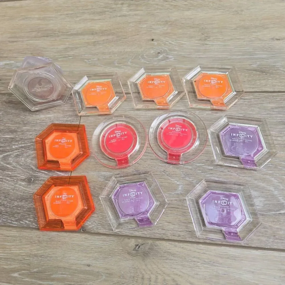 Disney Infinity power disc's lot of 11 Mulan, mickey, rapunzel, Alice, Nemo, car